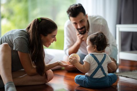 Family playing with a toddler at home, representative of Etobicoke households we clean for